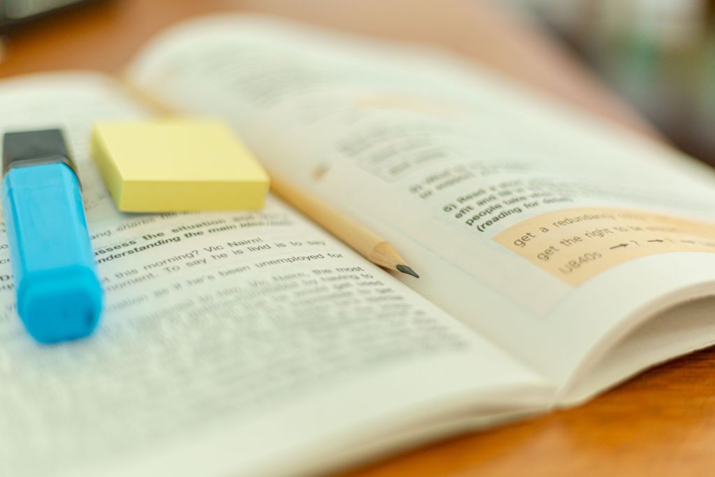 photo of a pencil on top of a book